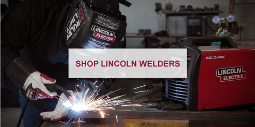 man welding with lincoln equipment